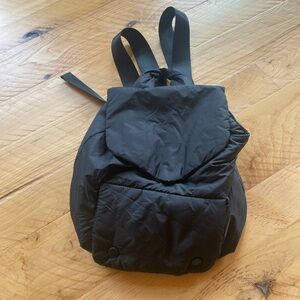 Black puffy down-like material backpack